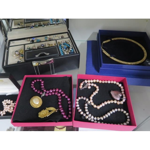 944 - A good assortment of costume and other jewellery including Swarovski, Michael Kors, Buckley