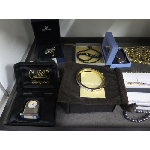 944 - A good assortment of costume and other jewellery including Swarovski, Michael Kors, Buckley