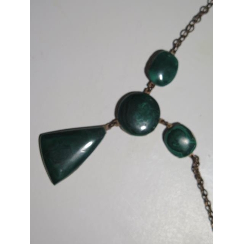 946 - Four malachite necklaces, a pendant and a bangle, longest necklace is 68cm with a 15mm diameter cent... 