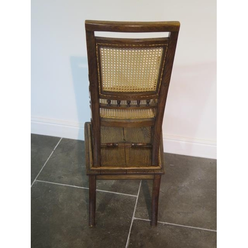 95 - A Victorian oak child's high chair on stand with Bergere cane seat and back, chair detaches from bas... 