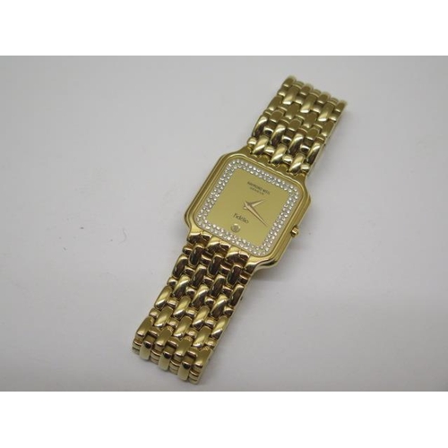 961 - A ladies gold plated Raymond Weil quartz watch, working with spare links