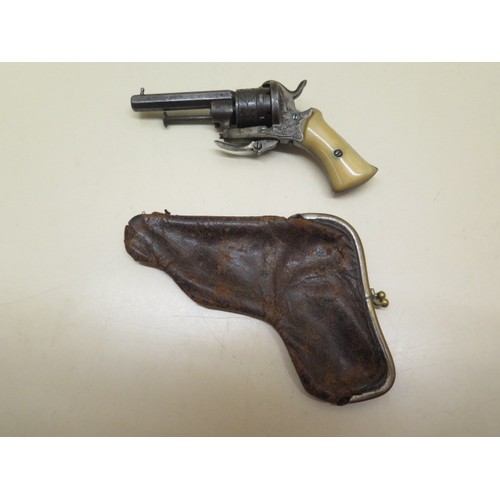 1087 - An ealry 1800s 0.54 pin fire revolver purse pistol, 13cm long, with leather purse, cocks and fires, ... 