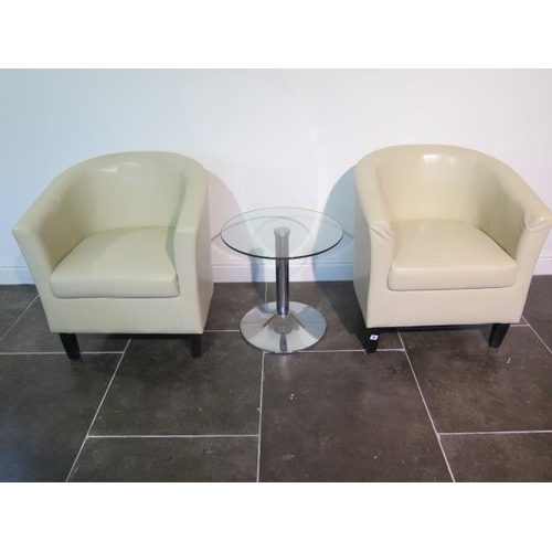 11 - A pair of faux leather cream tub chairs with a glass top coffee table, 49cm tall x 53cm, some usage ... 