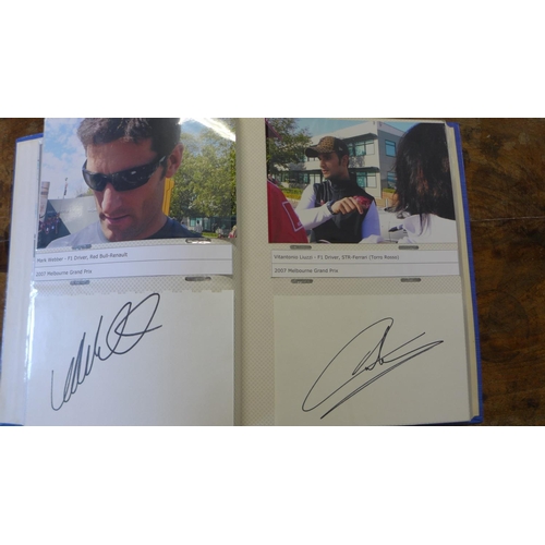 268 - A collection of 37 Formula 1 racing signatures including Sir Stirling Moss, Lewis Hamilton and Murra... 