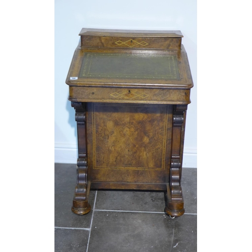 54 - A 19th century walnut Davenport with a single door enclosing four drawers, in need of some restorati... 