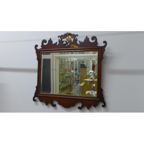 55 - A Georgian style mahogany phoenix mounted mirror, 57cm tall x 58cm wide, with restorations