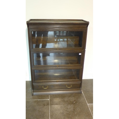 57 - A five piece glazed staking dark oak bookcase with a base drawer, 124cm tall x 87cm x 34cm, some bow... 