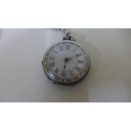 604 - A silver and gilt pocket watch and chain - approx weight 60 grams - no key but runs