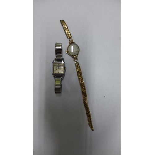 607 - A ladies Omega 9ct gold manual wind wristwatch on broken sprung strap - not running - and an Enicar ... 