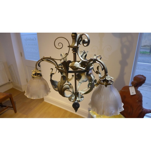 81 - A country house brass acanthus leaf hanging ceiling light with three glass holophane shades, 100cm t... 