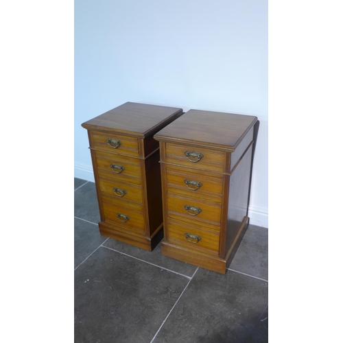 99 - A pair of mahogany four drawer pedestal bedside chests adapted from an Edwardian desk