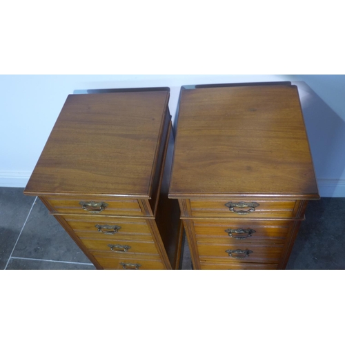 99 - A pair of mahogany four drawer pedestal bedside chests adapted from an Edwardian desk