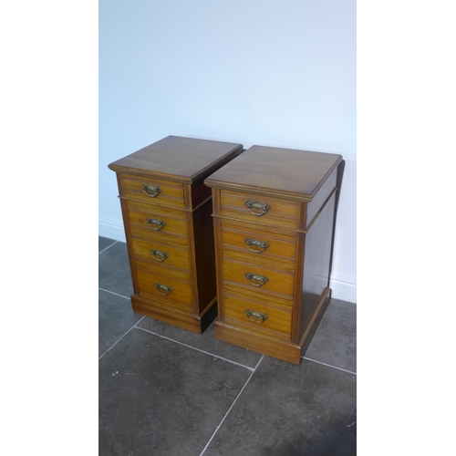 56 - A pair of mahogany four drawer pedestal bedside chests adapted from an Edwardian desk