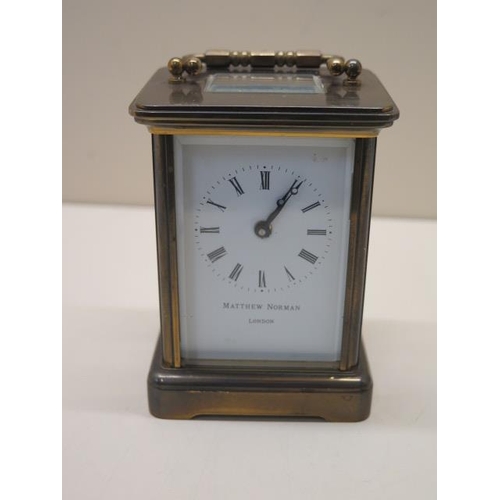 103 - An 8 day brass carriage clock by Matthew Norman of London - working order - generally good - Height ... 