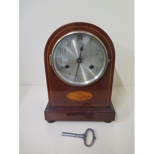 108 - An 8 day mahogany case mantle clock with inlay - Height 25cm - with key, running