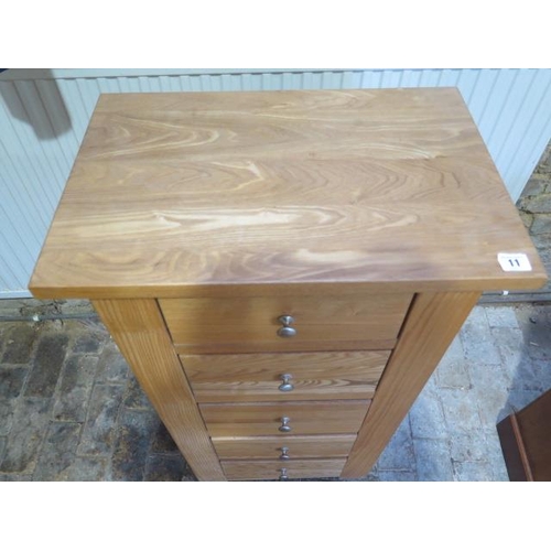 11 - A modern oak five drawer Wellington type chest - Height 101cm x 54cm x 35cm