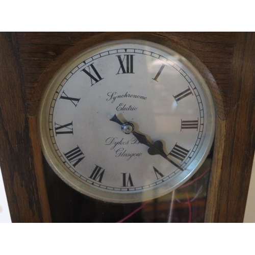 115 - An oak case synchronome electric factory master clock - Dykes Bros Glasgow - Height 126cm x Width 26... 