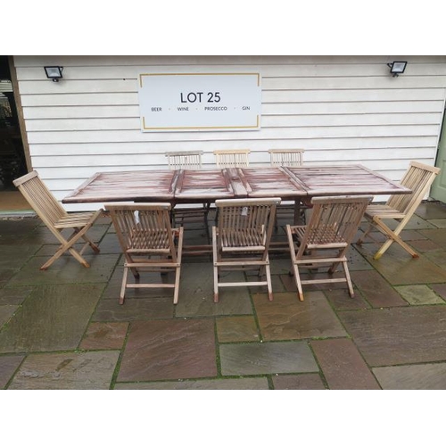 13 - A second hand teak garden table extends from 180cm to 296cm x 110cm wide with eight folding teak cha... 