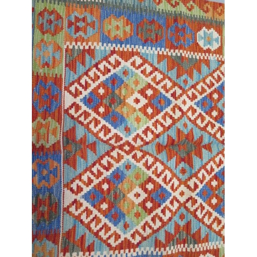 134 - A hand knotted woollen Chobi Kilim rug - 153cm x 101cm