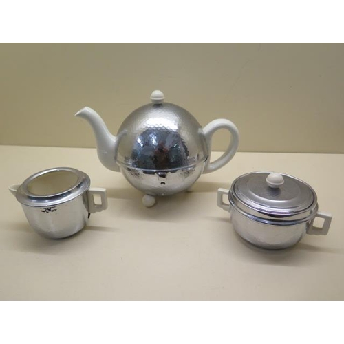 A vintage Heatmaster three piece tea set with globe teapot reasonably