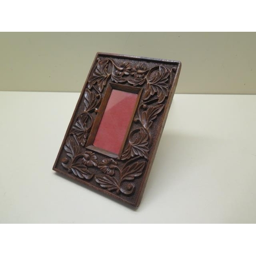 249 - A 19th century arts and crafts carved photo frame - 21cm x 15cm - in polished condition