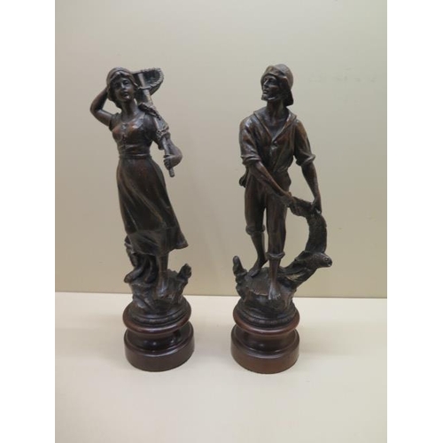 251 - A pair of 19th century Spelter figures - Fisherman and fish girl - Height 40cm - some small wear, lo... 