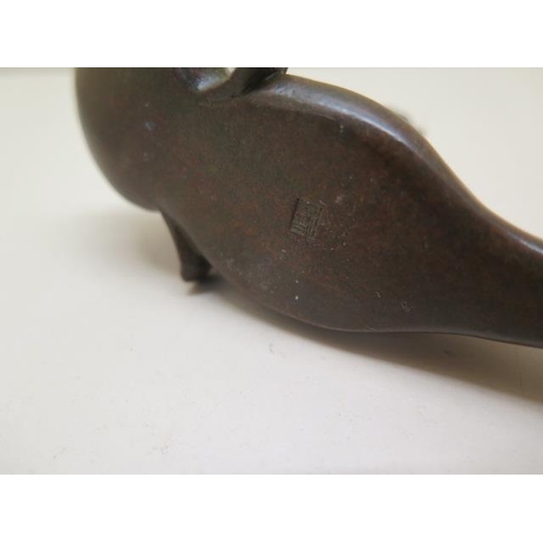 254 - A bronze cat on fish, signed to base - Length 12cm