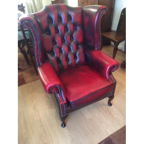 29 - A  leather wing back armchair Height 42 in 
Wing widest width 34 in
Seat height 17 in