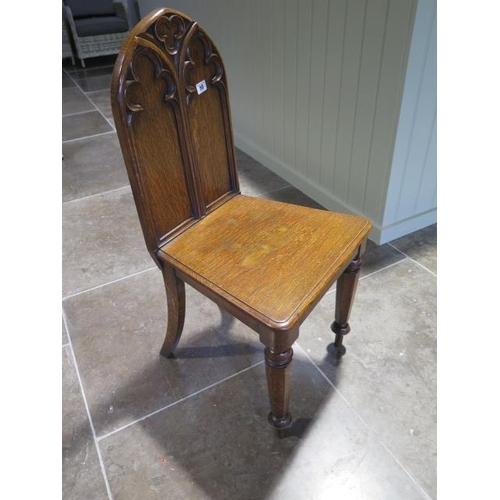 50 - A 19th century Gothic style hall chair in polished condition - Height 50cm