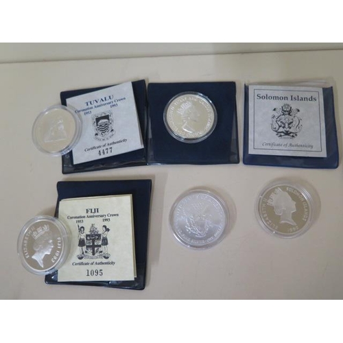 691 - Four silver Anniversary silver coins 1992 10 dollars, 1993 20 crowns, 1993 20 dollars and 1993 10 do... 