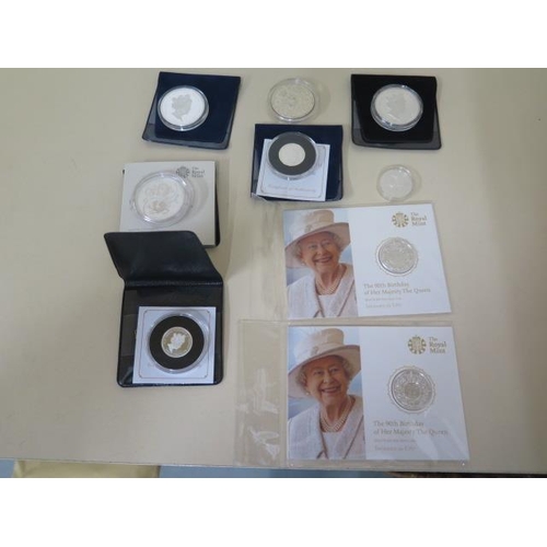 692 - Two fine silver £20 90th Birthday Elizabeth II coins in packets - St George and Dragon silver £1 coi... 