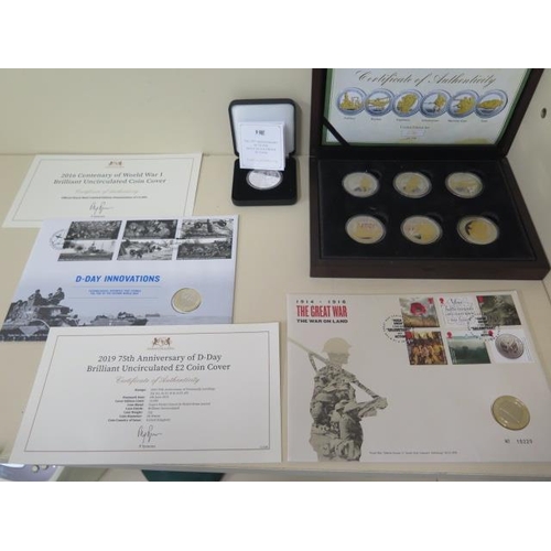 697 - A silver proof £5 75th Anniversary D-Day coin, a British Army six medal commemorative set and two Wo... 