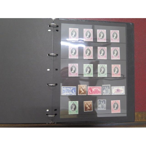 742 - Four Harrington and Byrne Elizabeth II stamp folders