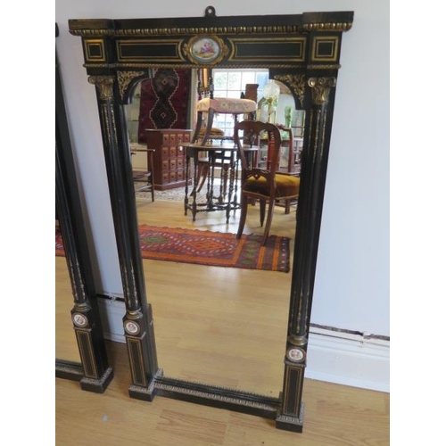 75 - A pair of Empire 19th century ebonised pier mirrors with porcelain plaques and ormolu mounts - 104cm... 