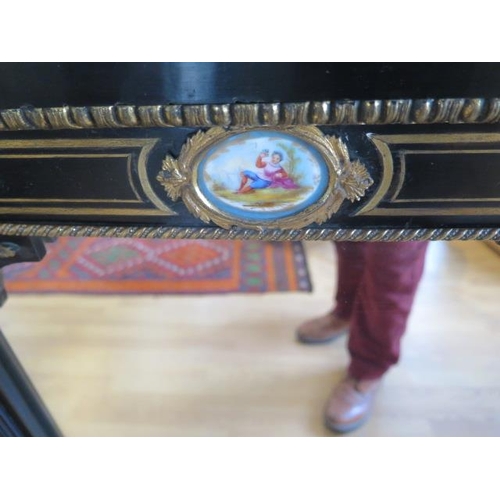 75 - A pair of Empire 19th century ebonised pier mirrors with porcelain plaques and ormolu mounts - 104cm... 