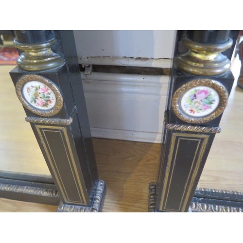 75 - A pair of Empire 19th century ebonised pier mirrors with porcelain plaques and ormolu mounts - 104cm... 