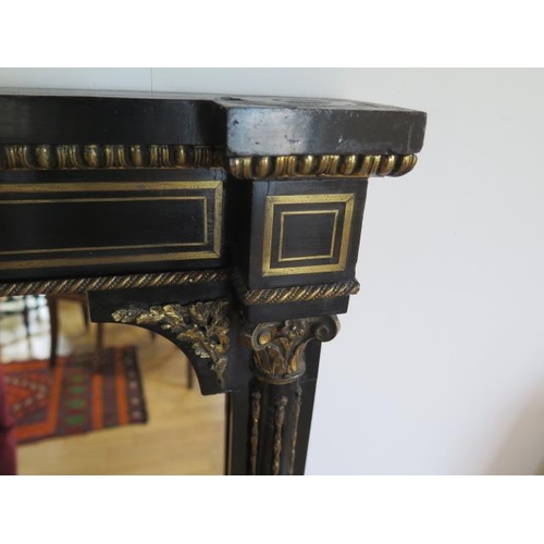 75 - A pair of Empire 19th century ebonised pier mirrors with porcelain plaques and ormolu mounts - 104cm... 