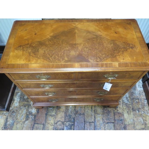 77 - A walnut veneered Georgian style chest with two small over three long drawers - in good clean condit... 