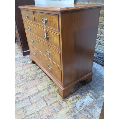 77 - A walnut veneered Georgian style chest with two small over three long drawers - in good clean condit... 