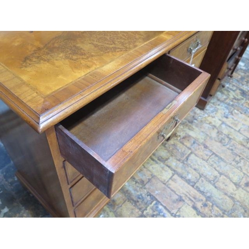 77 - A walnut veneered Georgian style chest with two small over three long drawers - in good clean condit... 