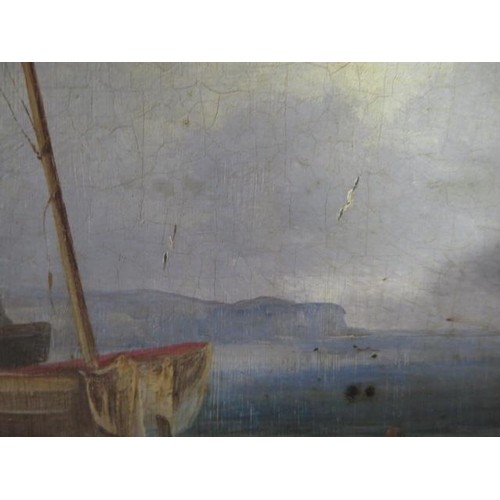 181 - An 18th/19th century oil on oak panel coastal scene with figures and boat to the foreground in a gil... 