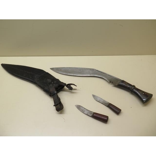 1025 - A horn handle Kukri with 31cm blade in leather covered wood scabbard together with its accompanying ... 