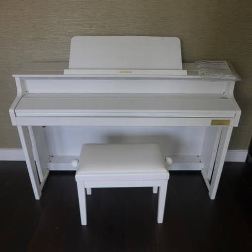 A Casio GP-300 Celviano Grand Satin white electric piano and a matching stool purchased from Millers Cambridge in 2019 - as new