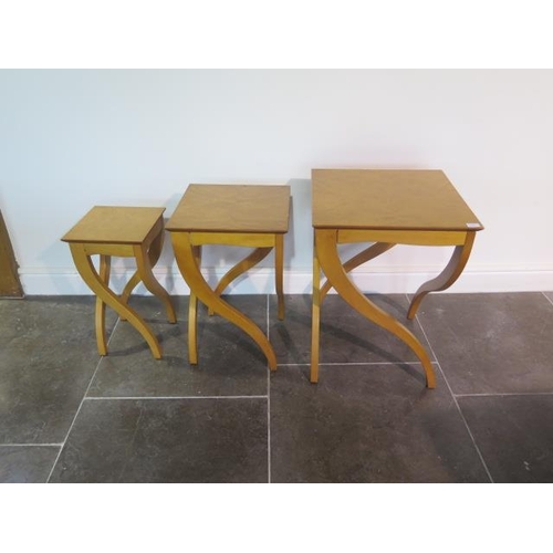 15A - A nest of three blonde wood side tables with shaped legs, top loose to one, legs need some attention