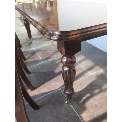 36 - A 19th century style pull out mahogany dining table with one leaf on turned reeded legs with six Chi... 