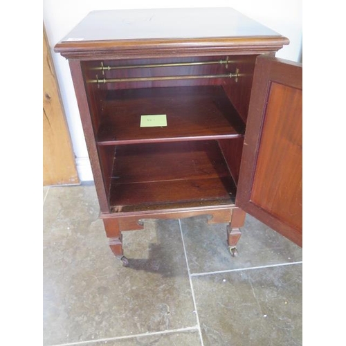 57 - An Edwardian mahogany bedside cupboard on casters - height 76cm x 49cm x 47cm