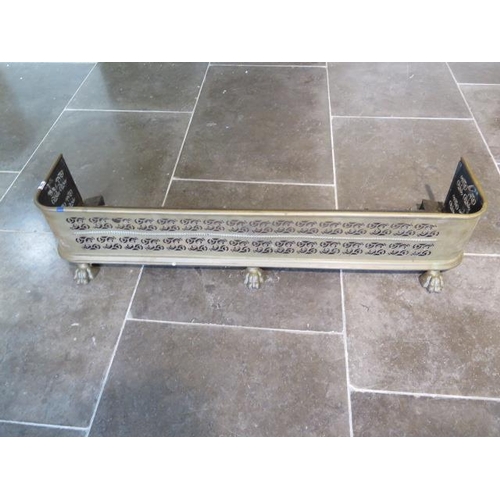 58 - A Victorian brass fire kerb on claw feet - height 25cm x 123cm x 33cm