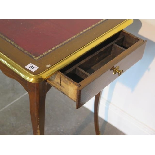 67 - A Continental side table with a leather inset top and a side drawer - height 72cm x 81cm x 49cm