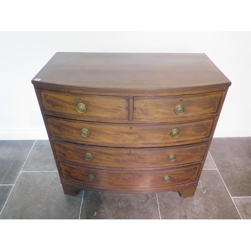 84 - A Goergian inlaid mahogany five drawer bowfronted chest standing on bracket feet - height 102cm x 10... 