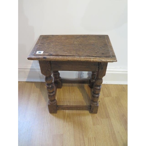 85 - An 18th century oak joint stool on turned supports - height 48cm x 41cm x 25cm